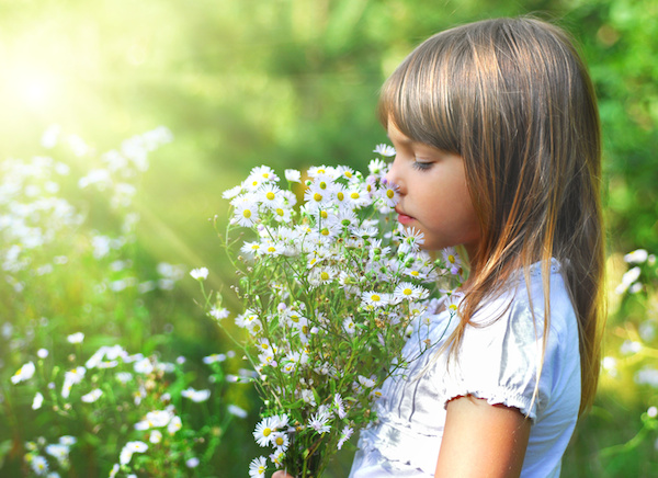 Little girl with the wild flowers